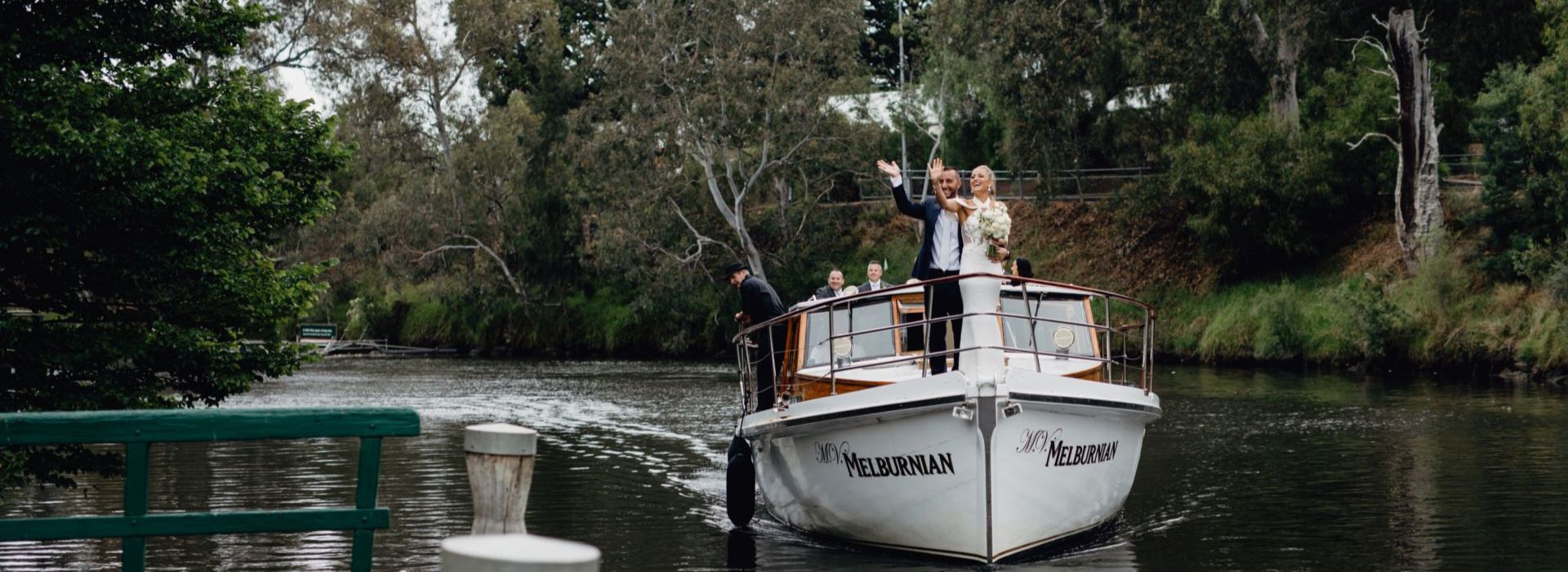 Newlyweds enjoying a romantic boat ride to Leonda, a Melbourne wedding venue.